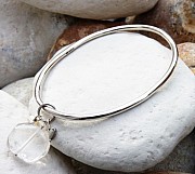 Sterling silver oval bangle with crystal quartz, freshwater pearl and silver heart