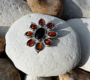 Sterling silver sunflower brooch with onyx and amber