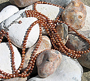 Three 50cm strands necklace of light copper freshwater pearls