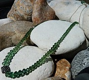 Necklace with erinite Swarovski crystals and a sterling silver ethnic bead